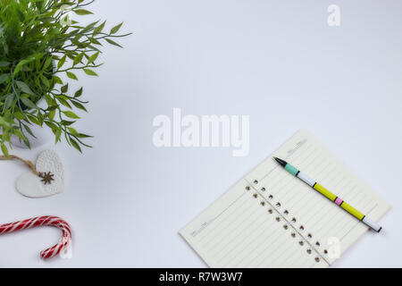 concept of recording your daily affairs. Notepad on a white background. Copy space layout Stock Photo