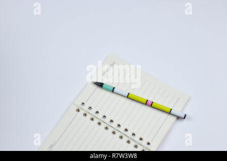 concept of recording your daily affairs. Notepad on a white background. Copy space layout Stock Photo