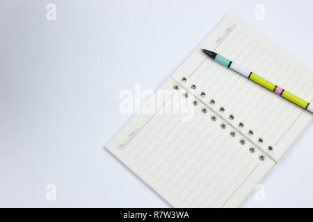 Back to school, the concept of education - a ballpoint pen close-up and a compositional book against the background of the new academic school year. C Stock Photo