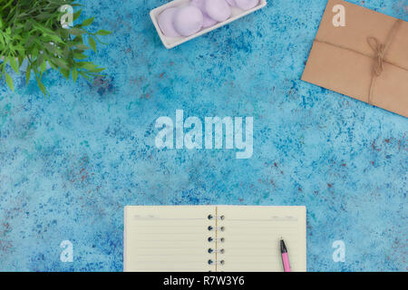 concept of recording your daily affairs on your desktop. Notepad on a blue abstract background. Copy space layout. place for text. Stock Photo