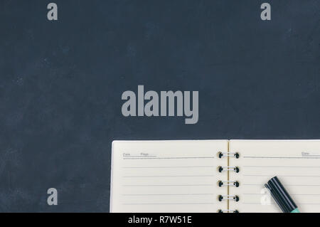 Office dark table. Empty booklet layout, brochure, diary, business portfolio mockup design template on black background. top view, copy Stock Photo