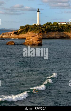 France, Pyrenees Atlantiques, Basque Country, Biarritz, stand up paddle on the Grande Plage (town's largest beach) and the lighthouse Stock Photo