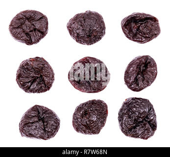 Close up picture of dried plums isolated on white. Stock Photo