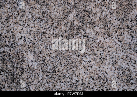 Natural stone. Pink granite. Black Granite. Grey Granite. Facing material. Granite texture. Bright hard granite rock texture. Granite stone background Stock Photo