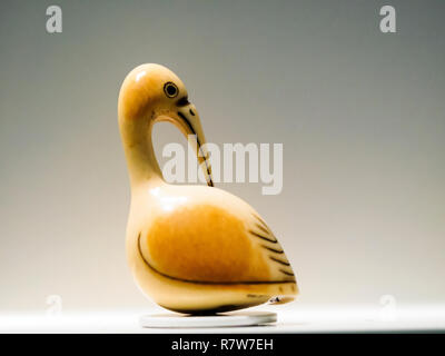 Crane Preening its feathers Netsuke figurine Stock Photo