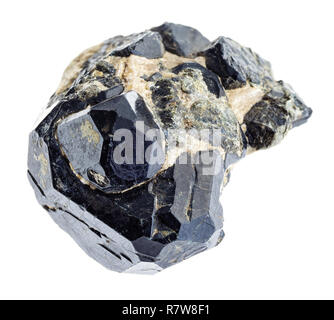macro photography of natural mineral from geological collection - raw black spinel crystal on black diopside stones on white background Stock Photo