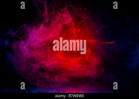 red and blue smoke patterns at dark background Stock Photo
