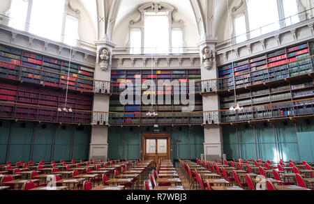 Interior of the historic Octagon Library at Queen Mary, University of London, Mile End UK. Colourful leather bound books line the shelves. Stock Photo