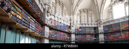Panorama of interior of the historic Octagon Library at Queen Mary, University of London, Mile End UK. Colourful leather bound books line the shelves. Stock Photo