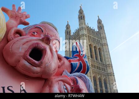 London, UK. Tuesday 11 December 2018 - pro & anti Brexit demonstrators gather to voice their views, after Teressa May delays parliamentary vote on deal. A Lorry with effigies of key ministerial supporters of Brexit parks near Parliament Buildings in London - UK Credit: Iwala/Alamy Live News Stock Photo