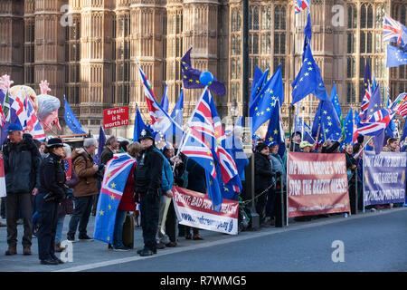 London, UK. 11th December, 2018. Anti-Brexit activists protest outside Parliament on the day on which a vote was originally to have been scheduled on completion of a House of Commons debate on the Government's draft Brexit withdrawal agreement. Stock Photo