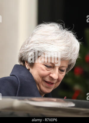 London, UK. 12th Dec, 2018. British Prime Minister Theresa May leaves Downing Street for Prime Minister's Questions in London, Britain on Dec. 12, 2018. British Prime Minister Theresa May will face a vote of no confidence later Wednesday, said Graham Brady, head of the Conservative Party's 1922 Committee of backbenchers. Credit: Isabel Infantes/Xinhua/Alamy Live News Stock Photo