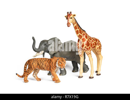 Pastic wild african animal toys isolated on white. Tiger, Elephant and giraffe. Children animal characters for playing zoo game. Stock Photo