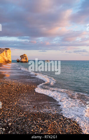 Beautiful afternoon view in  portrait format of the beach around Petra tou Romiou, in Paphos, Cyprus. It is considered to be Aphrodite's birthplace in Stock Photo