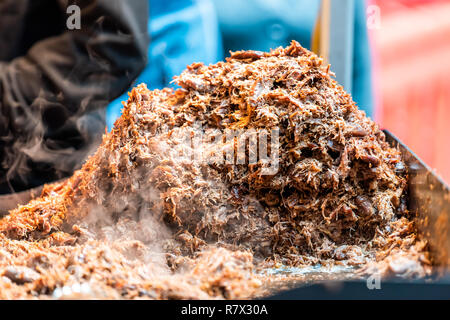 Shredded pork barbeque bbq meat large beef pile in fast food truck counter showing detail texture, orange brown fresh color, pattern, hot steam smoke Stock Photo
