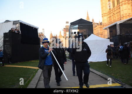 Steve Bray is escorted from College Green on the day of the Meaningful Vote (that never took place). 11th December 2018. Stock Photo