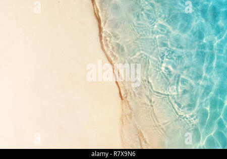 Soft beautiful ocean wave on sandy beach. Summer background. Stock Photo