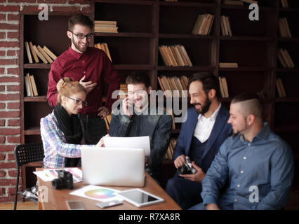 creative group of designers at a working meeting in the Studio. Stock Photo