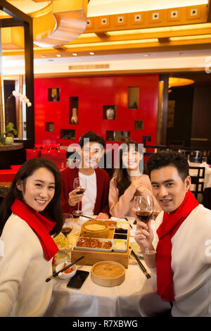 Young people in the restaurant for dinner Stock Photo