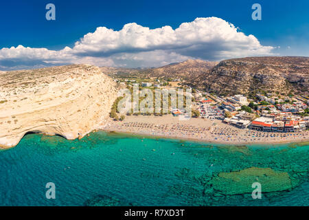 Aerial view of Matala beach on Crete island with azure clear water, Greece, Europe. Crete is the largest and most populous of the Greek islands.
