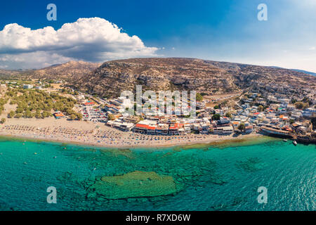 Aerial view of Matala beach on Crete island with azure clear water, Greece, Europe. Crete is the largest and most populous of the Greek islands.