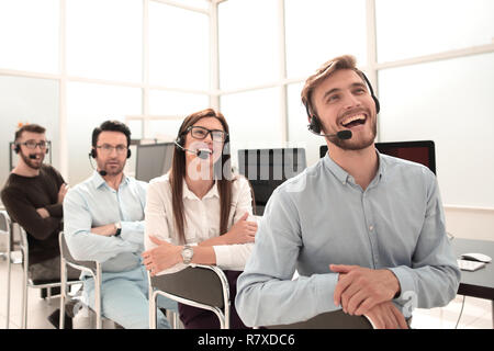 smiling operators support in the workplace Stock Photo