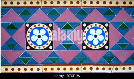 Geometric Coloured Tiles. Flower Design Tiles. Triangles. Circles. Tiled Wall. Coloured Tiles. Stock Photo