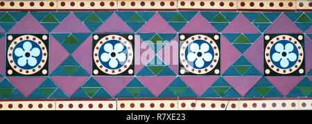 Geometric Coloured Tiles. Flower Design Tiles. Triangles. Circles. Tiled Wall. Coloured Tiles. Stock Photo
