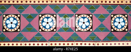 Geometric Coloured Tiles. Flower Design Tiles. Triangles. Circles. Tiled Wall. Coloured Tiles. Stock Photo