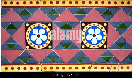 Geometric Coloured Tiles. Flower Design Tiles. Triangles. Circles. Tiled Wall. Coloured Tiles. Stock Photo