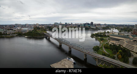 Aerial panoramic view of Alexandra Bridge going over Ottawa River from Quebec to Ontario. Taken in Hull, Gatineau, Quebec, Canada. Stock Photo