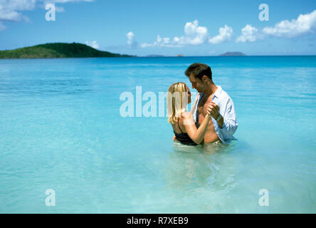 Couple dancing in the sea together Stock Photo
