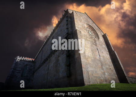 Gothic church of the monastery of Santa Clara in vila do Conde from the XIV century (1318) in Vila do Conde, near Porto; photo composition with clouds Stock Photo