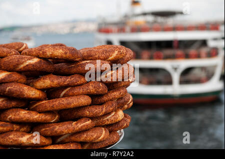 Typical Turkish Street Food; Simit for sale on the Galata Bridge in Istanbul, Turkey Stock Photo