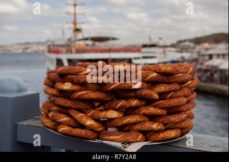 Typical Turkish Street Food; Simit for sale on the Galata Bridge in Istanbul, Turkey Stock Photo