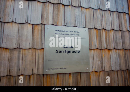 PUERTO VARAS, CHILE, SEPTEMBER, 23, 2018: Facade made of larch, texture, Puerto Varas, Chile. Close-up Stock Photo