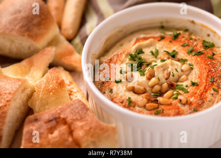 Close up of hummus with pine nuts Stock Photo