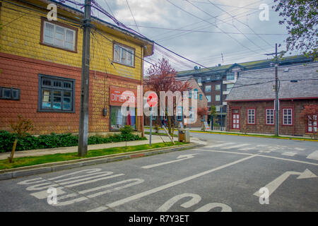 PUERTO VARAS, CHILE, SEPTEMBER, 23, 2018: Outdoor view of yellow wooden house building located in Puerto Varas in Chile Stock Photo