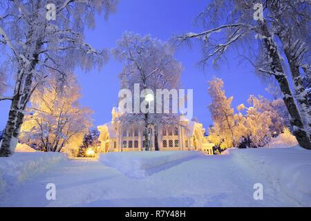 Sweden, Lapland, region listed as World Heritage by UNESCO, Norrbotten County, Blue hour profile view of the Lutheran Lutheran Church of Jokkmokk (Jokkmokks Kyrka) in the heart of the Sami capital, built in 1887, renovated in 1949 Stock Photo