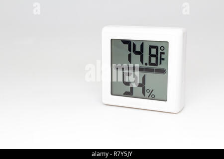 Digital device measuring temperature and humidity. Thermometer and hygrometer. Fahrenheit and percent. Stock Photo