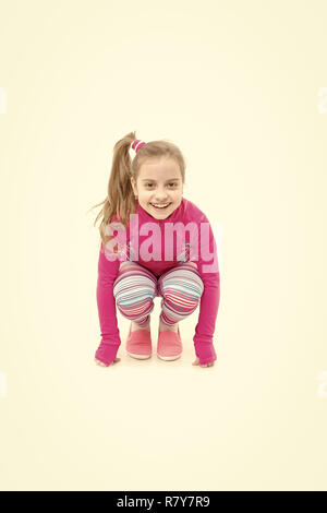 Workout of small girl isolated on white background. Sport and