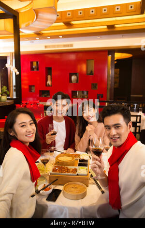 Young people in the restaurant for dinner Stock Photo