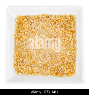 Breadcrumbs in bowl isolated on white background Stock Photo