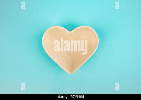 Heart Bowl isolated on light blue background Stock Photo