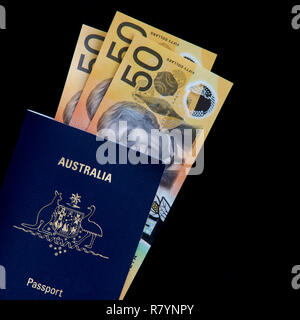 Australian fifty dollar notes and an Australian passport. Stock Photo