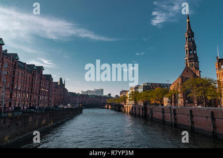 Hamburg, Germany - November 17, 2018: View of the Elbe river, going through the iconic Speicherstadt or old factory and warehouse district in the city Stock Photo