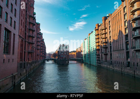 Hamburg, Germany - November 17, 2018: View of the Elbe river, going through the iconic Speicherstadt or old factory and warehouse district in the city Stock Photo