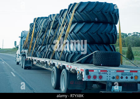 Truck hauling very large tires. Freeway 94 Illinois IL USA Stock Photo ...