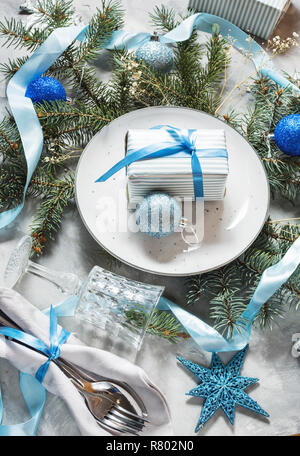 Beautiful Christmas table setting with decorations. Preparation for christmas dinner. Stock Photo