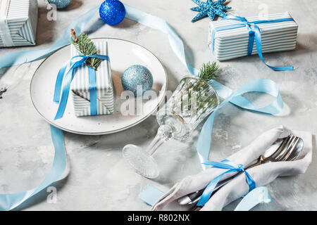 Beautiful Christmas table setting with decorations. Preparation for christmas dinner. Stock Photo
